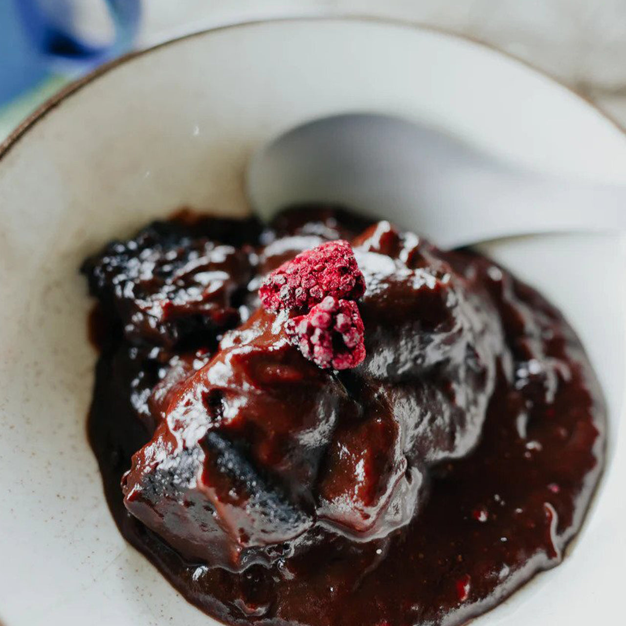 Our take on chocolate self-saucing pudding, with chocolate brownie, boysenberries and chocolate sauce. www.moralepatches.com.au