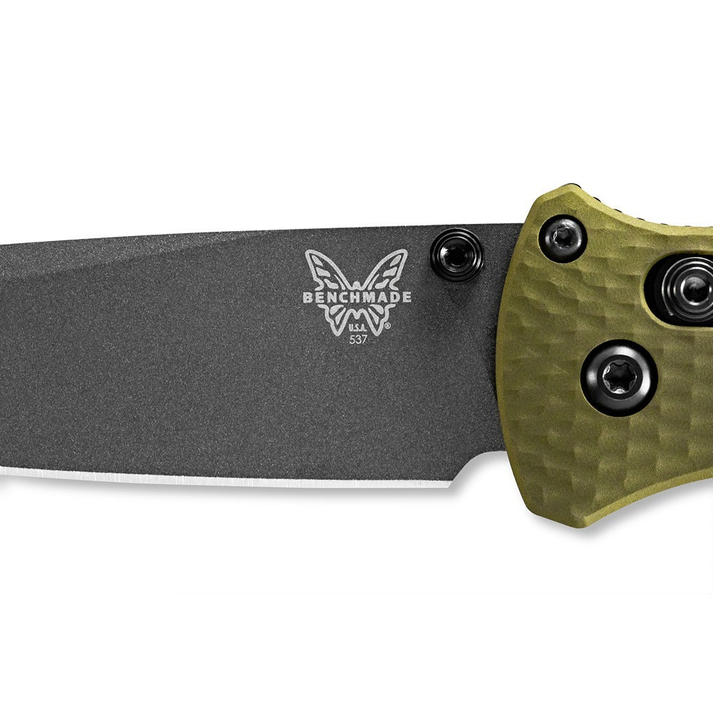 Upgrade your folding knife game with the powerful 537GY-1 Bailout. Boasting a slim profile but built with strong CPM-M4 steel and woodland green aluminum handles, this knife is the ultimate lightweight powerhouse. Plus, the carbide glass breaker on the pommel adds an extra layer of versatility. www.moralepatches.com.au