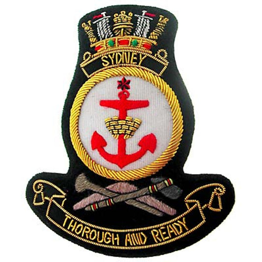 An exquisite HMAS Sydney Bullion Pocket Badge to complete your outfit - perfect for your blazer, bag, or anywhere else you'd like to adorn a unique badge. Boasting a size of approximately 80x80mm, it fastens securely with three butterfly catches on the back. www.moralepatches.com.au