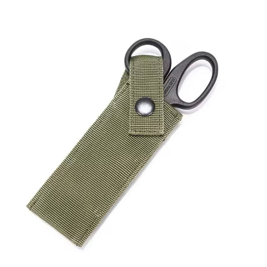 This locally made pouch is designed for tactical vests plus belts and offers a sleek, lightweight, and effective solution. It features a padded sleeve for a single pair of medium sized trauma shears, with an easy access button clip system that can be operated with one hand. The pouch only requires one MOLLE column for attachment, ensuring quick and convenient access to vital tools when every second counts. www.moralepatches.com.au