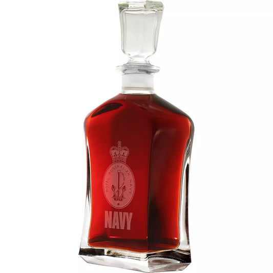 Experience the elegance and sophistication of the Navy Italian Glass Decanter with its beautifully etched crest. The 750ml capacity and sleek design make it a must-have addition to any cabinet or bar. Elevate your home bar experience with this high-quality decanter. www.moralepatches.com.au