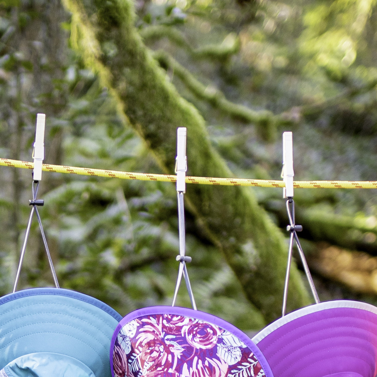 So tiny and compact, this is the perfect portable clothesline that you can take on all of your trips. Our Clothesline uses two parallel cords with rubber 'beads' that can slide along the cords. Hang the clothesline by wrapping each end around a convenient suspension point, then hook it in place. Wet items are then secured between the two cords by sliding the beads together. www.moralepatches.com.au