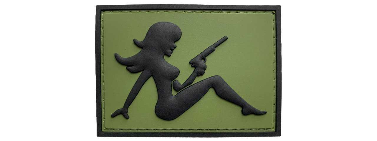 Mudflap Girlwith Pistol on Left Hand PVC Patch, Velcro backed Badge. Great for attaching to your field gear, jackets, shirts, pants, jeans, hats or even create your own patch board.  Size: 7x5cm