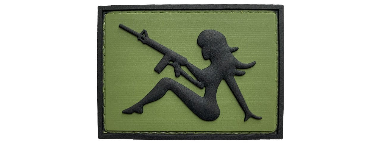 Mudflap Girl with Rifle on Right Hand PVC Patch, Velcro backed Badge. Great for attaching to your field gear, jackets, shirts, pants, jeans, hats or even create your own patch board.  Size: 7x5cm