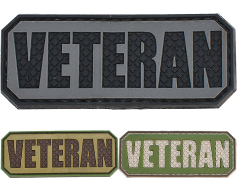 Veteran Tab PVC Patch, Velcro backed Badge. Great for attaching to your field gear, jackets, shirts, pants, jeans, hats or even create your own patch board.  Size: 6.3x2.5cm