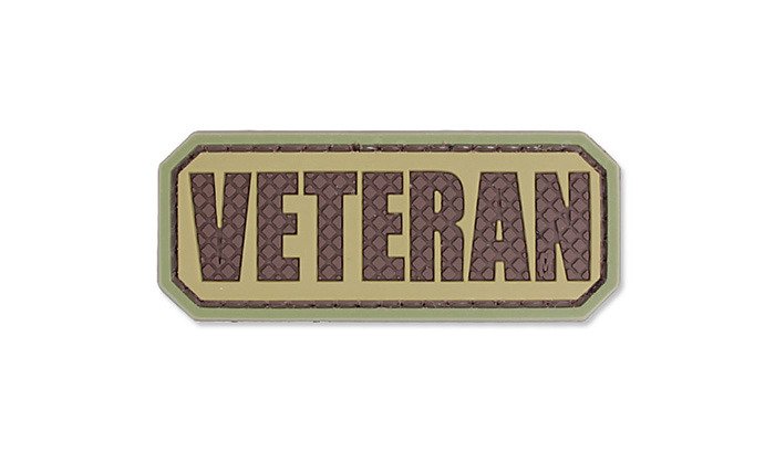 Veteran Tab PVC Patch, Velcro backed Badge. Great for attaching to your field gear, jackets, shirts, pants, jeans, hats or even create your own patch board.  Size: 6.3x2.5cm