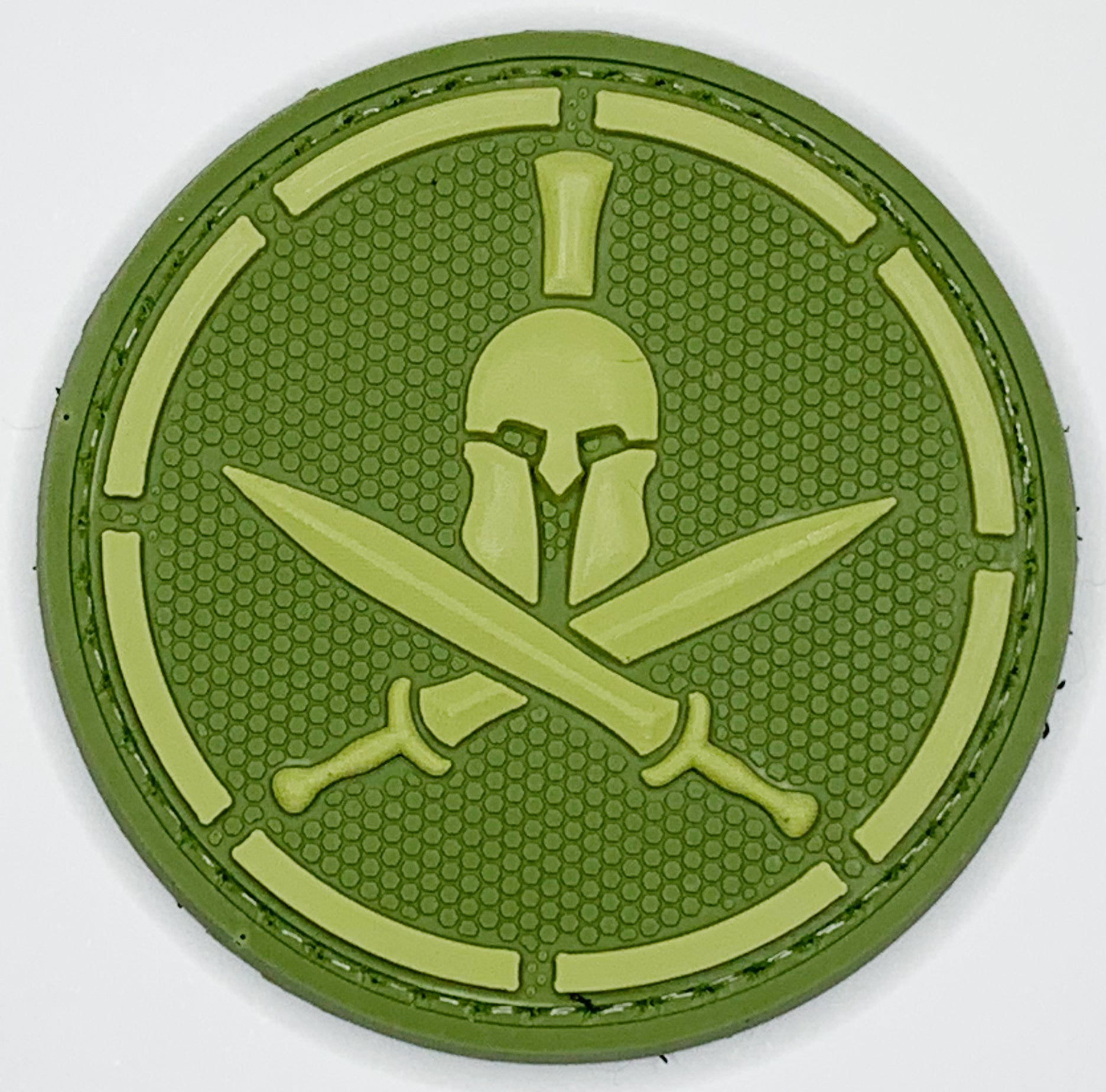 Spartan Helmet Crossed Swords PVC Patch, Velcro backed Badge. Great for attaching to your field gear, jackets, shirts, pants, jeans, hats or even create your own patch board.  Size: 6cm