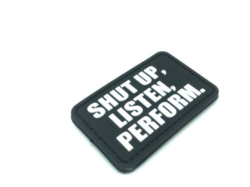 Shut Up Listen Perform PVC Patch, Velcro backed Badge. Great for attaching to your field gear, jackets, shirts, pants, jeans, hats or even create your own patch board.  Size: 7x4.5cm