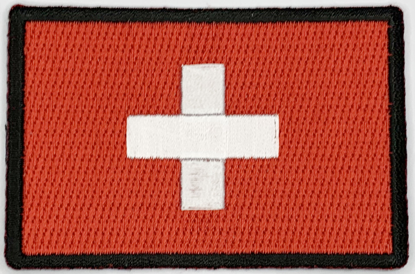 Swiss Flag Iron On Patch. Great for attaching to your jackets, shirts, pants, jeans, hats.  Size: 7.62x5.08cm