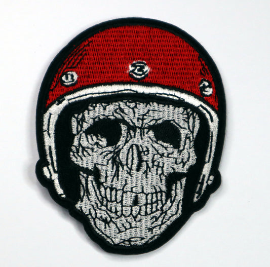 Skull with red helmet Iron On Patch. Great for attaching to your jackets, shirts, pants, jeans, hats.  Size: 7x9.2cm