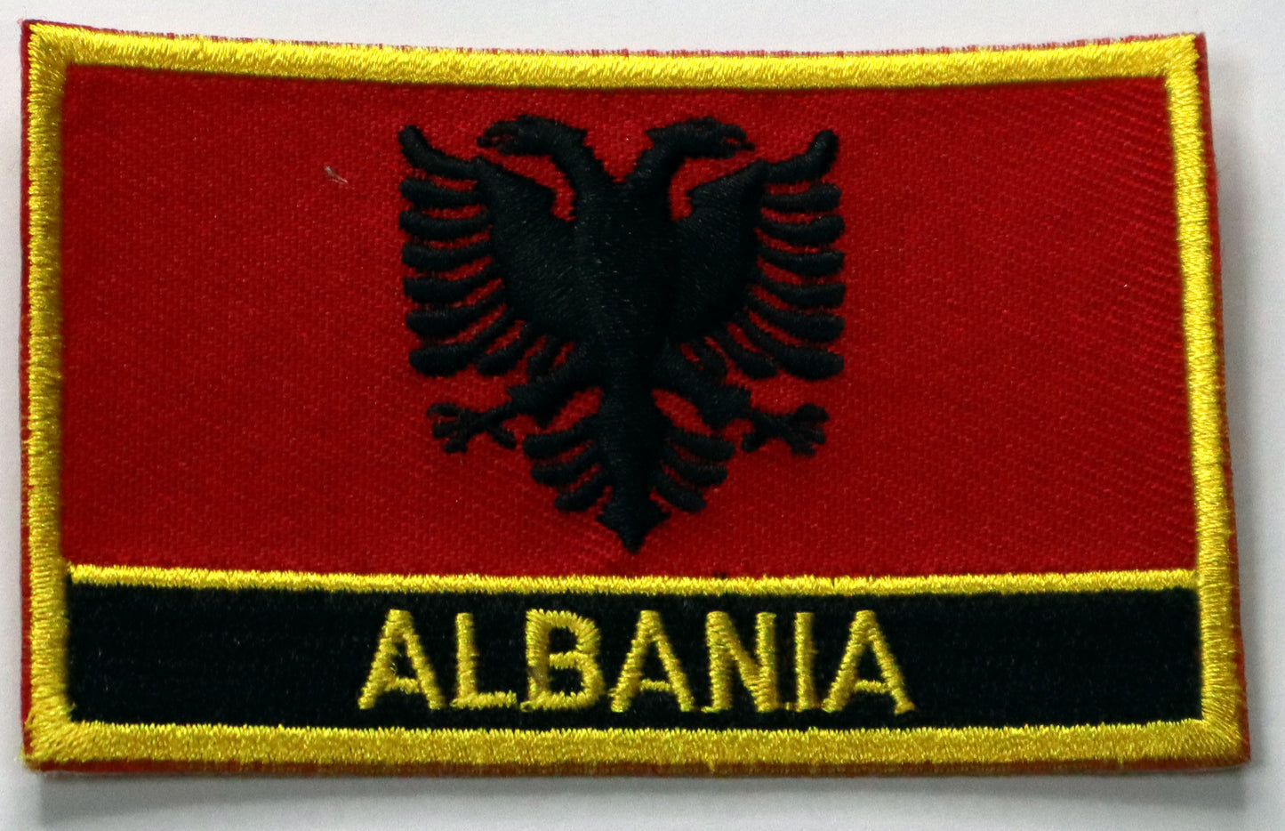 Albania Flag Iron On Patch. Great for attaching to your jackets, shirts, pants, jeans, hats.  Size: 8x5cm