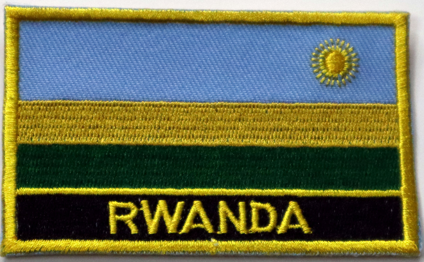 Rwanda Flag Iron On Patch. Great for attaching to your jackets, shirts, pants, jeans, hats.  Size: 8x5cm