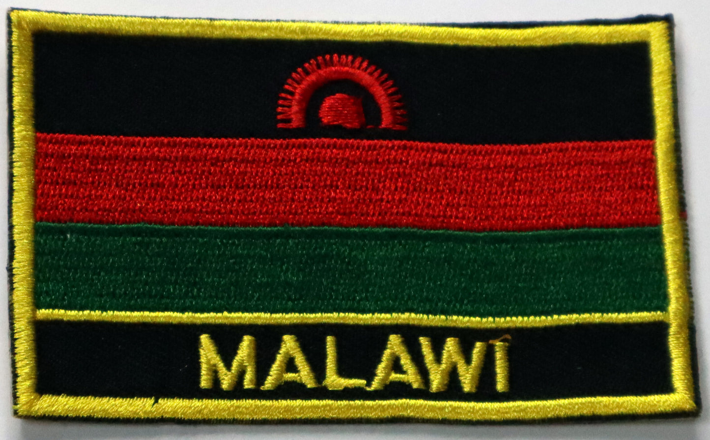 Malawi Flag Iron On Patch. Great for attaching to your jackets, shirts, pants, jeans, hats.  Size: 8x5cm