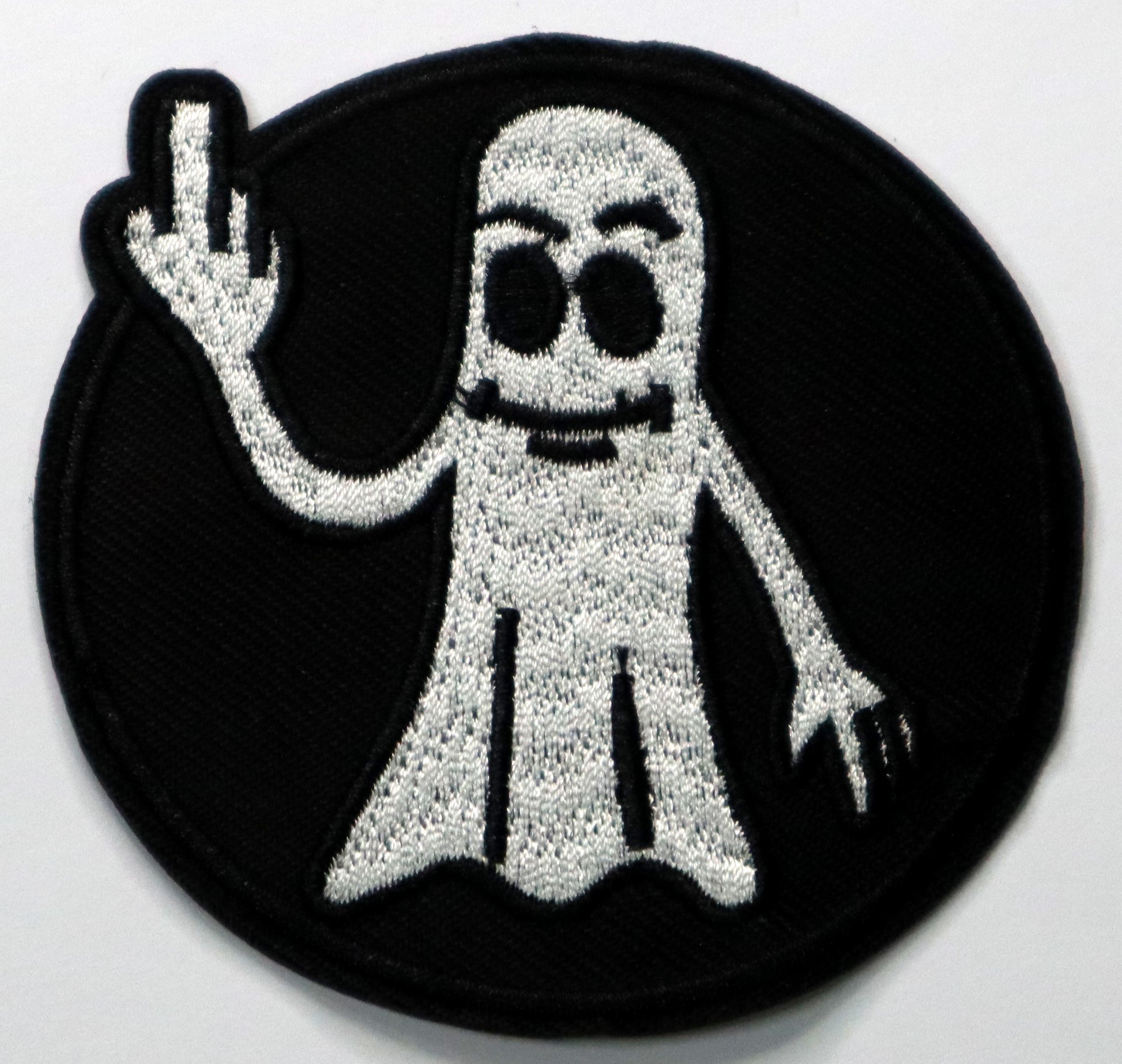 Ghost giving the finger Iron On Patch. Great for attaching to your jackets, shirts, pants, jeans, hats.  Size: 7.8cm