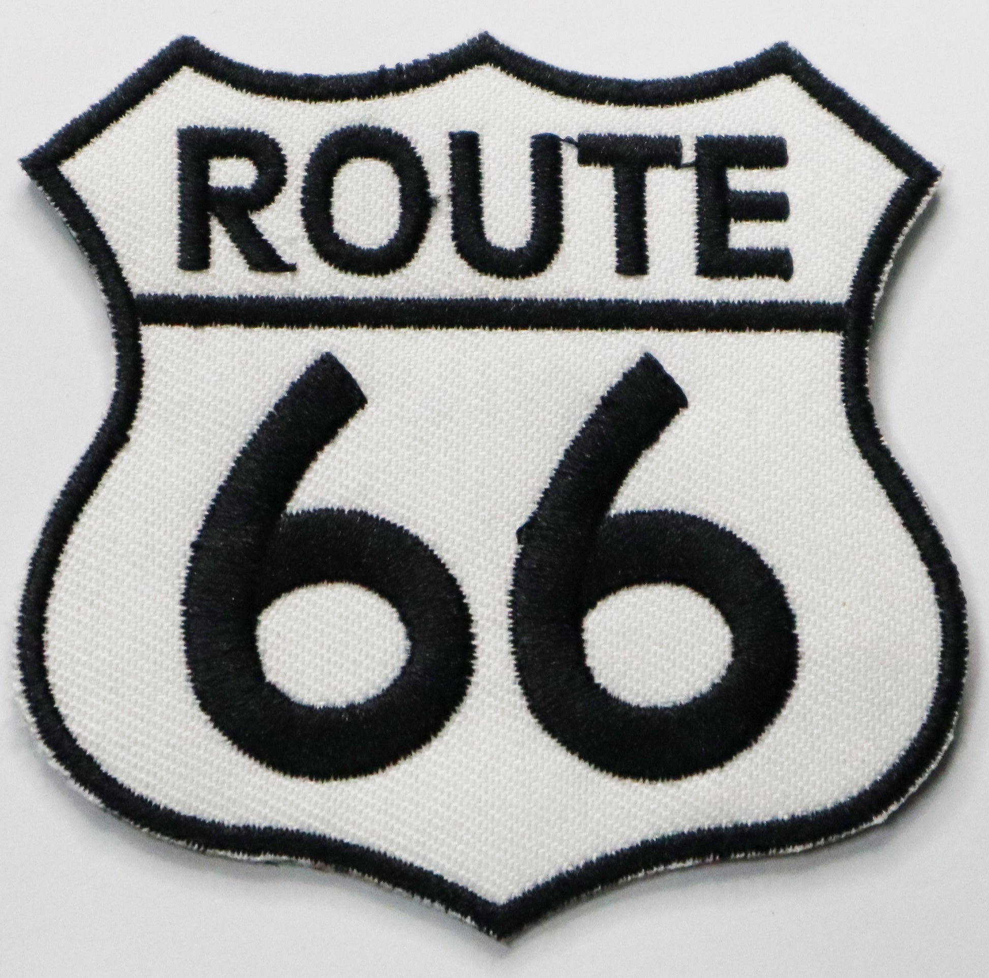 Route 66 black & white Iron On Patch. Great for attaching to your jackets, shirts, pants, jeans, hats.  Size: 7x7cm