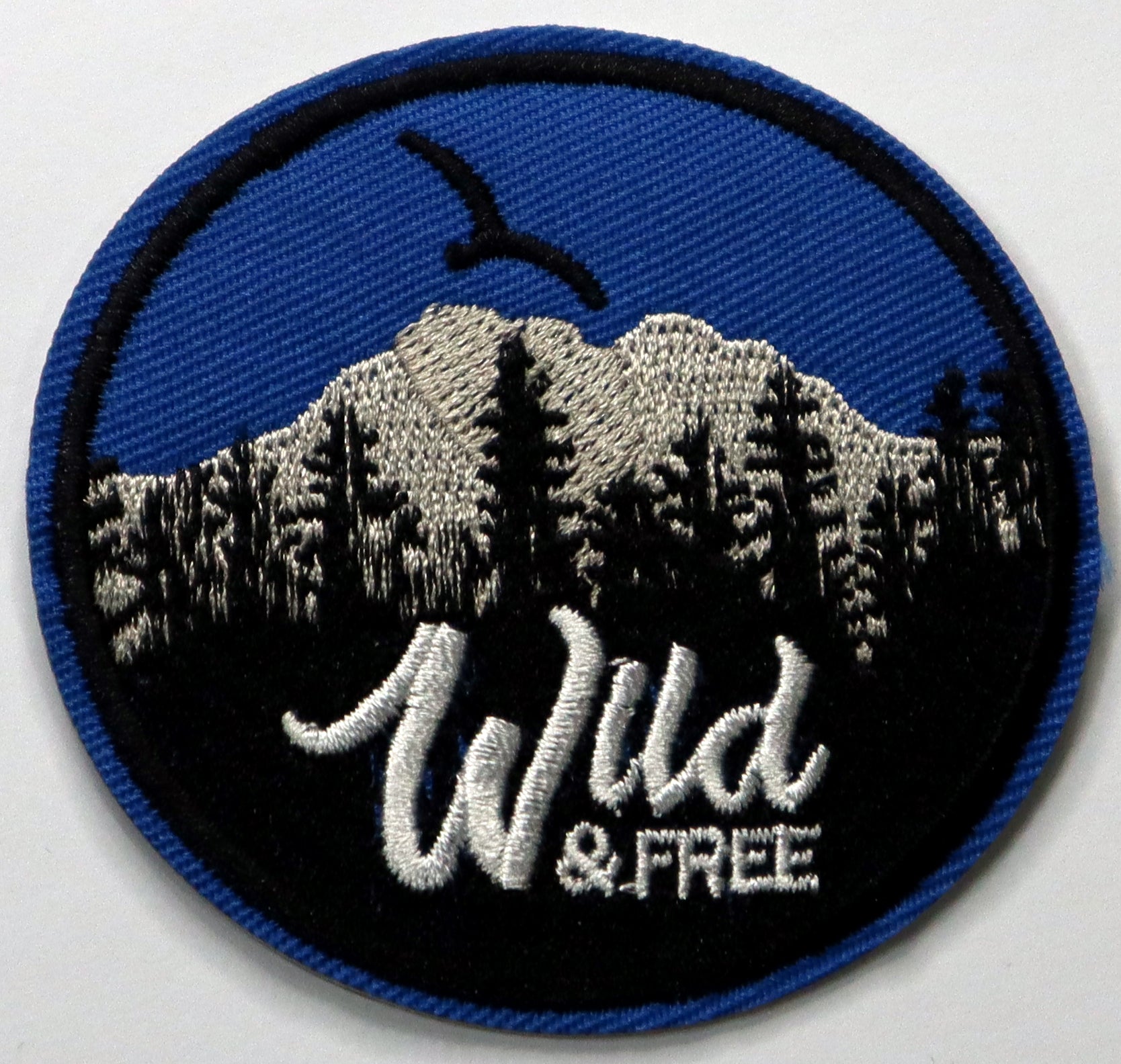 Wild and free Iron On Patch. Great for attaching to your jackets, shirts, pants, jeans, hats.  Size: 7cm