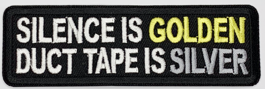 Silence is golden, duct tape is silver Iron On Patch. Great for attaching to your jackets, shirts, pants, jeans, hats.  Size: 10.4X3.3cm