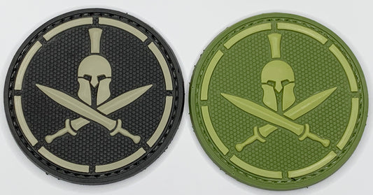 Spartan Helmet Crossed Swords PVC Patch, Velcro backed Badge. Great for attaching to your field gear, jackets, shirts, pants, jeans, hats or even create your own patch board.  Size: 6cm